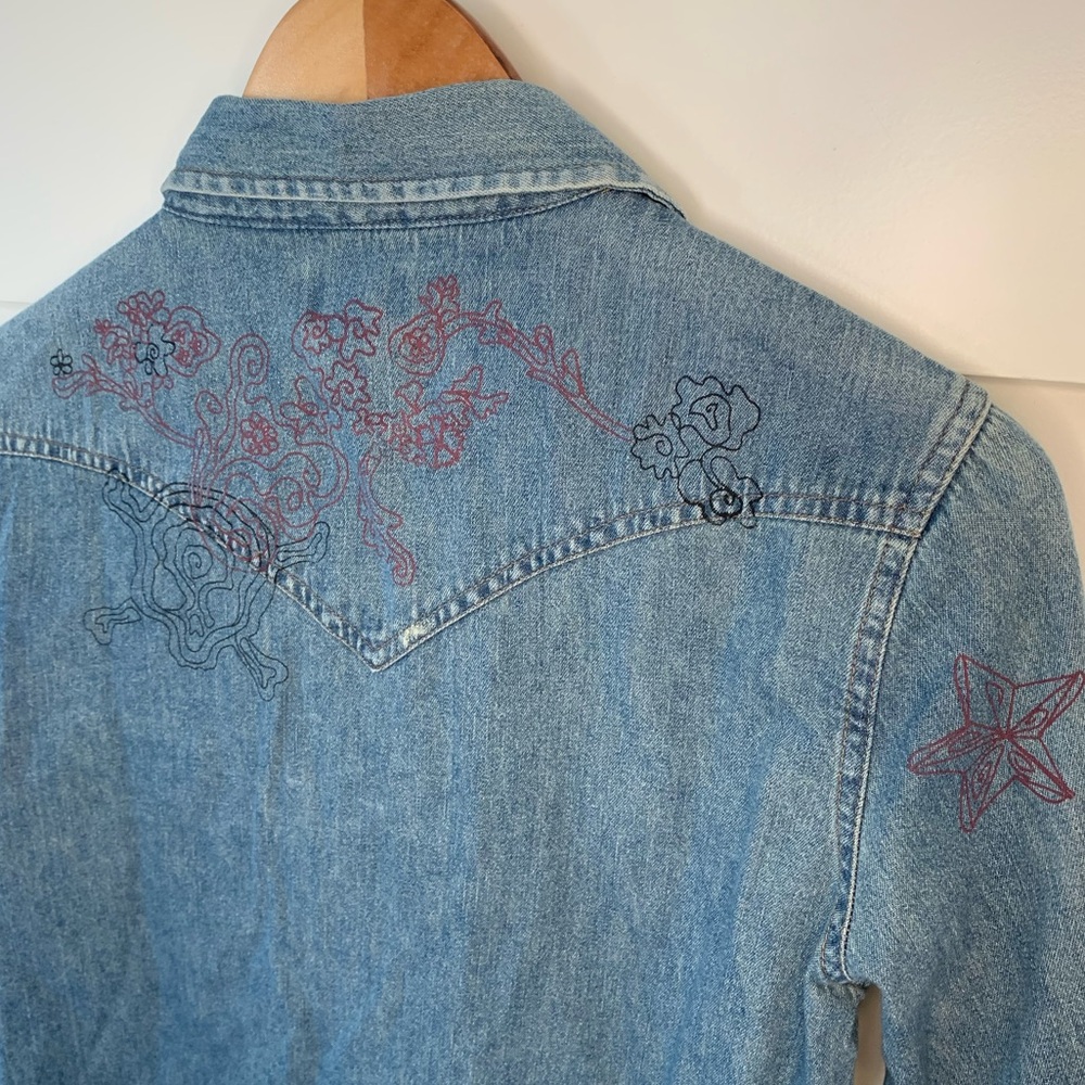 Levi’s cotton western denim shirt with pearl snaps and skull and flower print.